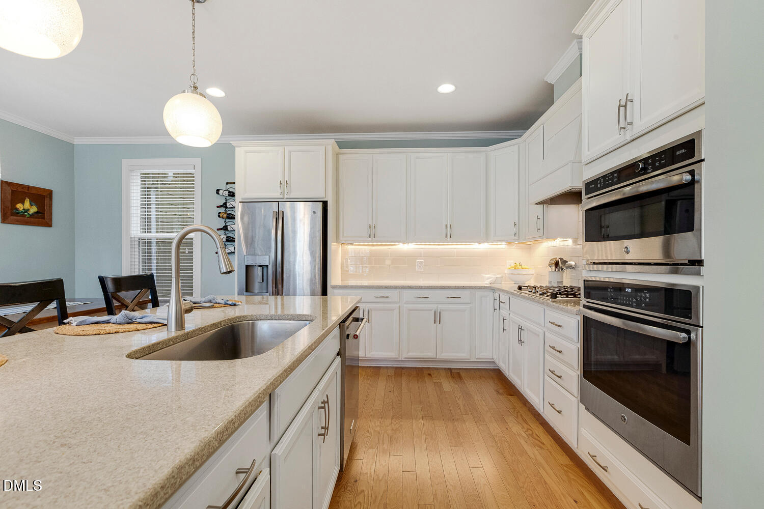 538 Rowanwood Way Apex, NC 27523 - Photo 13 of 40 a kitchen with a sink appliances and cabinets