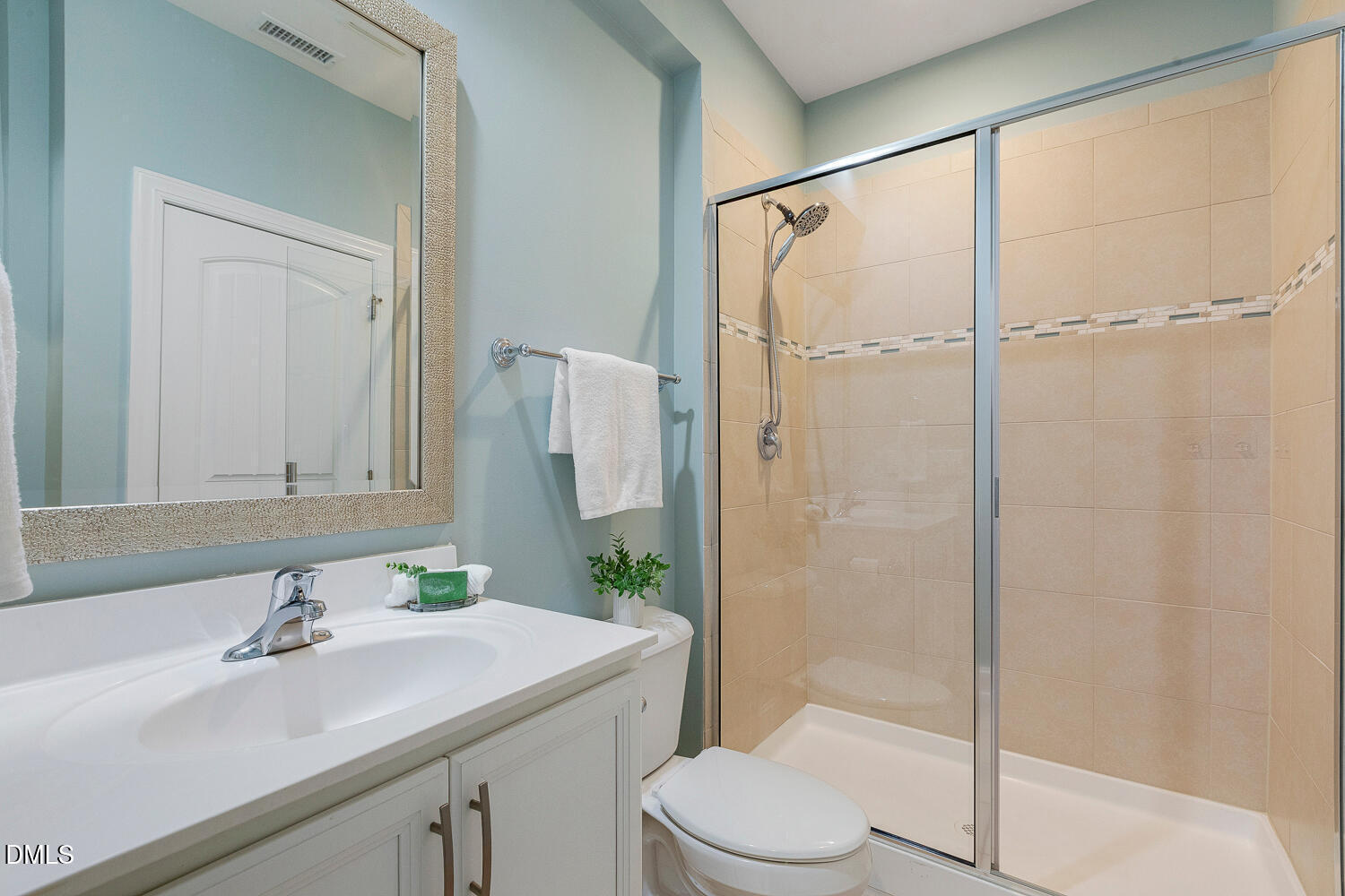 538 Rowanwood Way Apex, NC 27523 - Photo 18 of 40 a bathroom with a sink toilet and shower