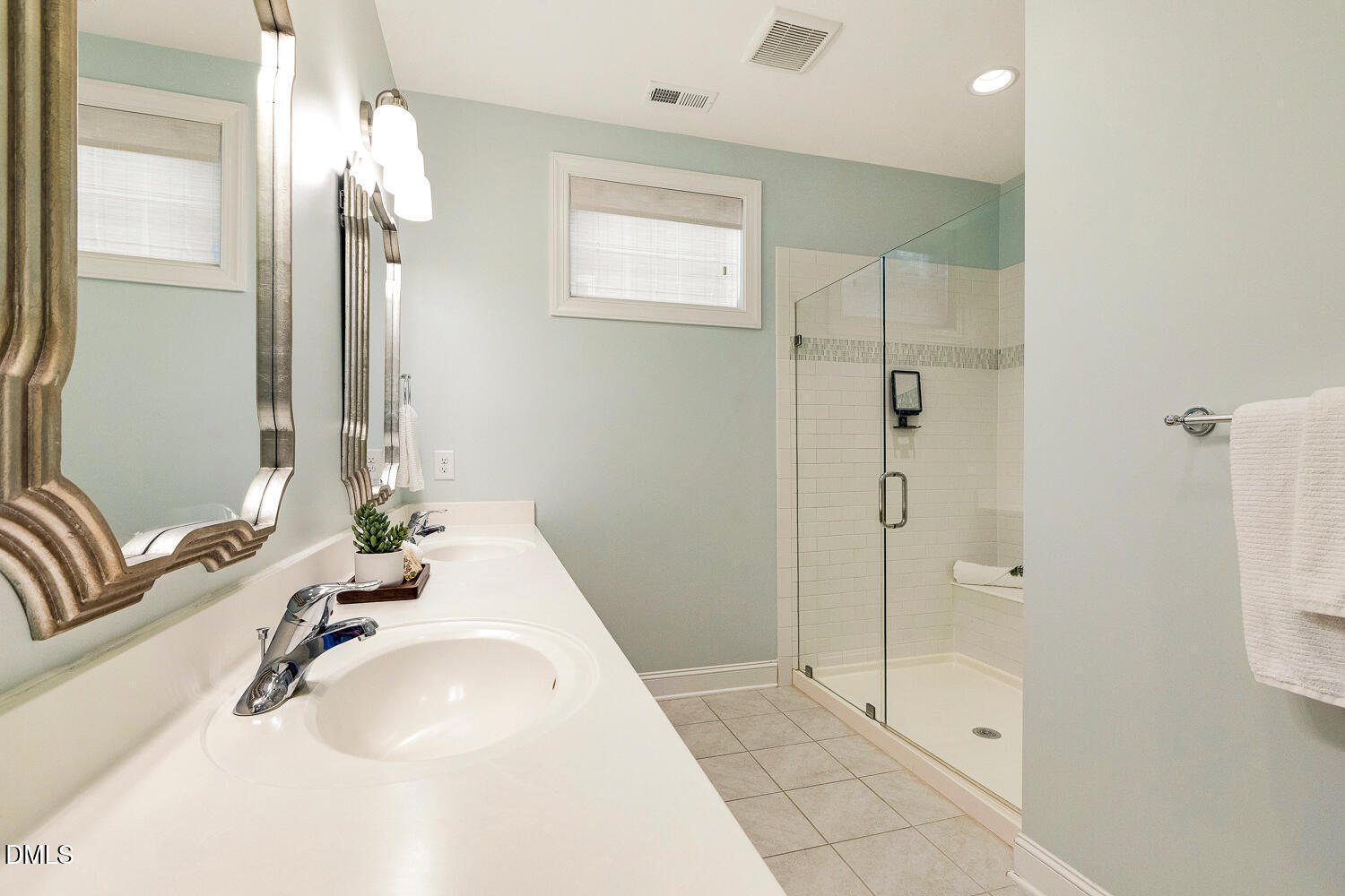 538 Rowanwood Way Apex, NC 27523 - Photo 21 of 40 a bathroom with a tub sink and mirror