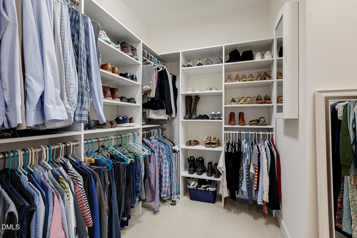 538 Rowanwood Way Apex, NC 27523 - Photo 23 of 40 a view of walk in closet with clothes and shoes