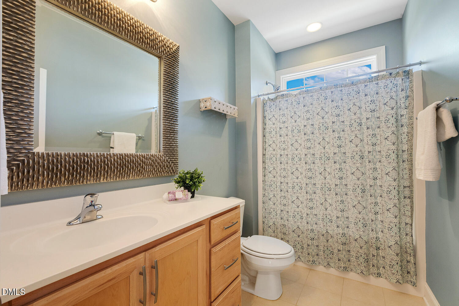 538 Rowanwood Way Apex, NC 27523 - Photo 25 of 40 a bathroom with a sink toilet and shower