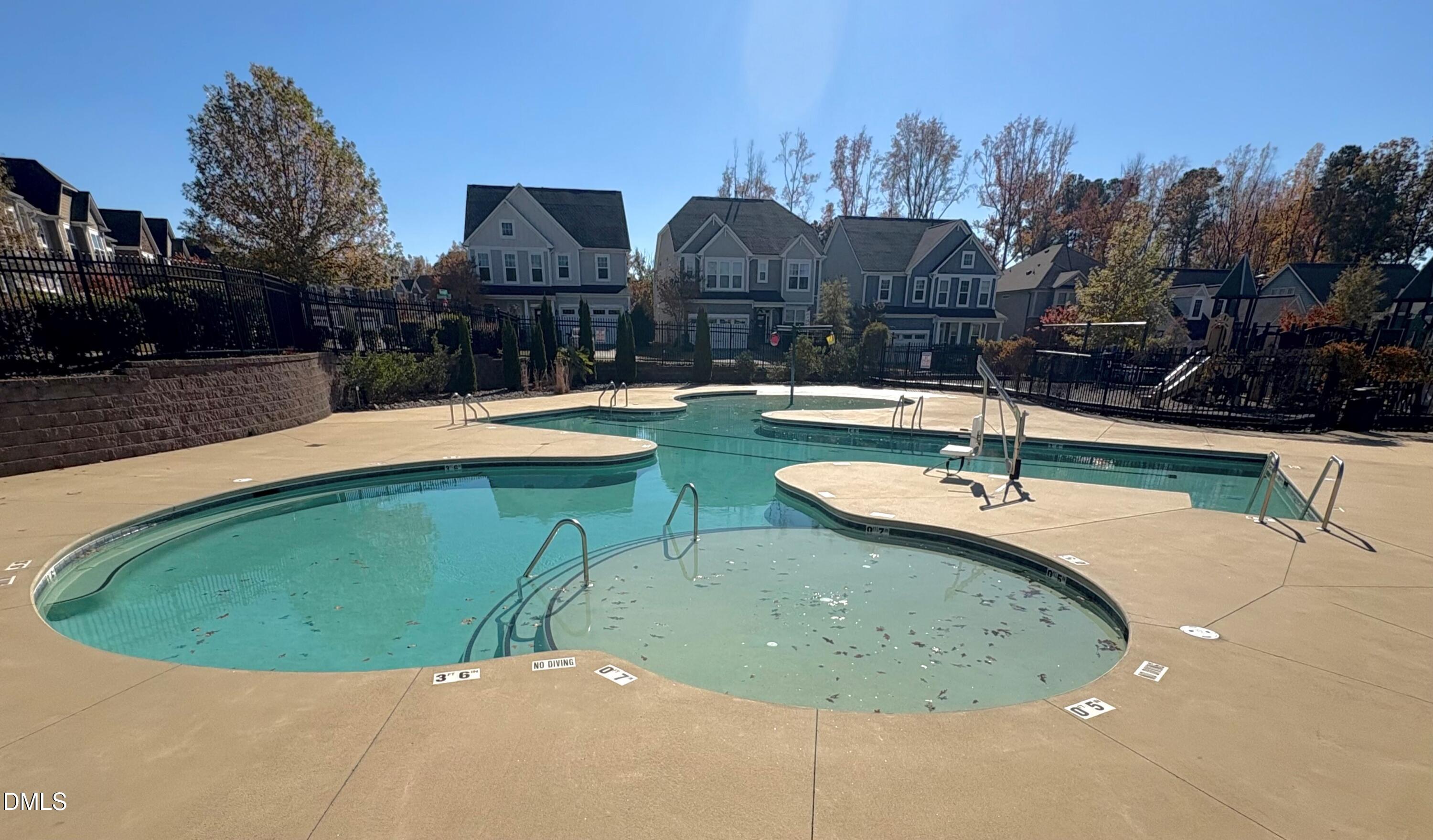 538 Rowanwood Way Apex, NC 27523 - Photo 35 of 40 a view of a swimming pool with a yard