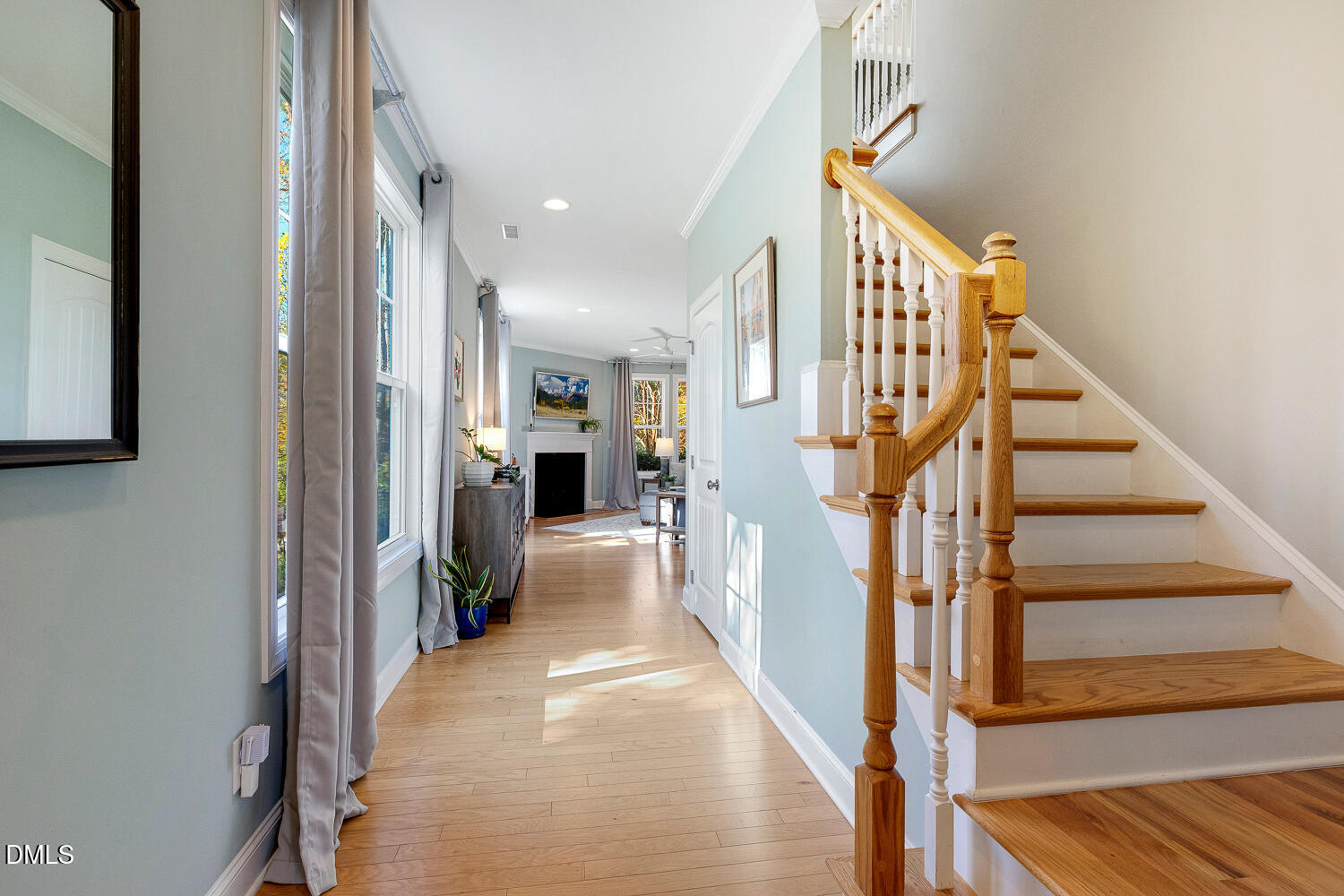 538 Rowanwood Way Apex, NC 27523 - Photo 4 of 40 a view of entryway and hall with wooden floor