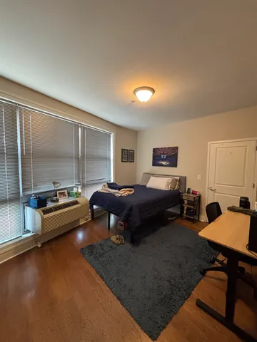 a bedroom with furniture and a bed