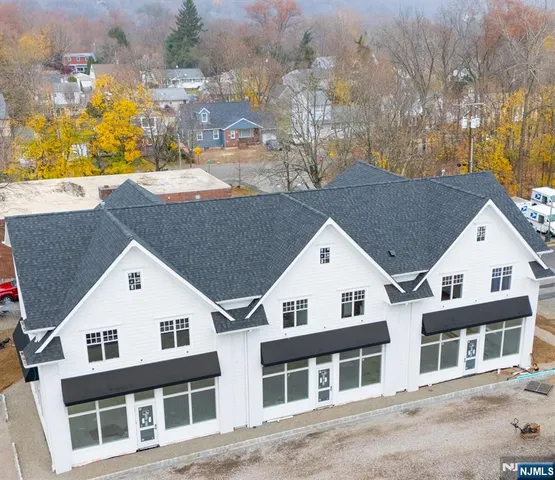 a view of a white building among the street