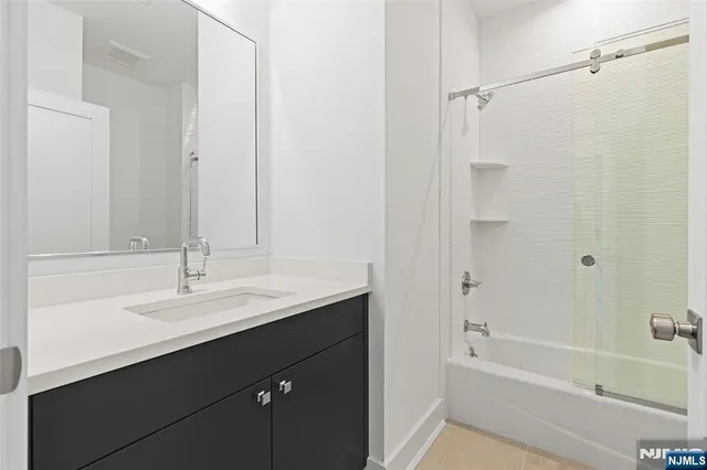 a bathroom with a sink and a bathtub