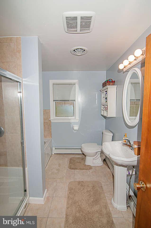 3721 Macalpine Road Ellicott City, MD 21042 - Photo 12 of 22 a room with a mirror and a workspace
