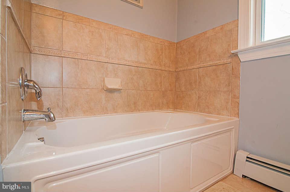 3721 Macalpine Road Ellicott City, MD 21042 - Photo 13 of 22 a bathroom with a bathtub
