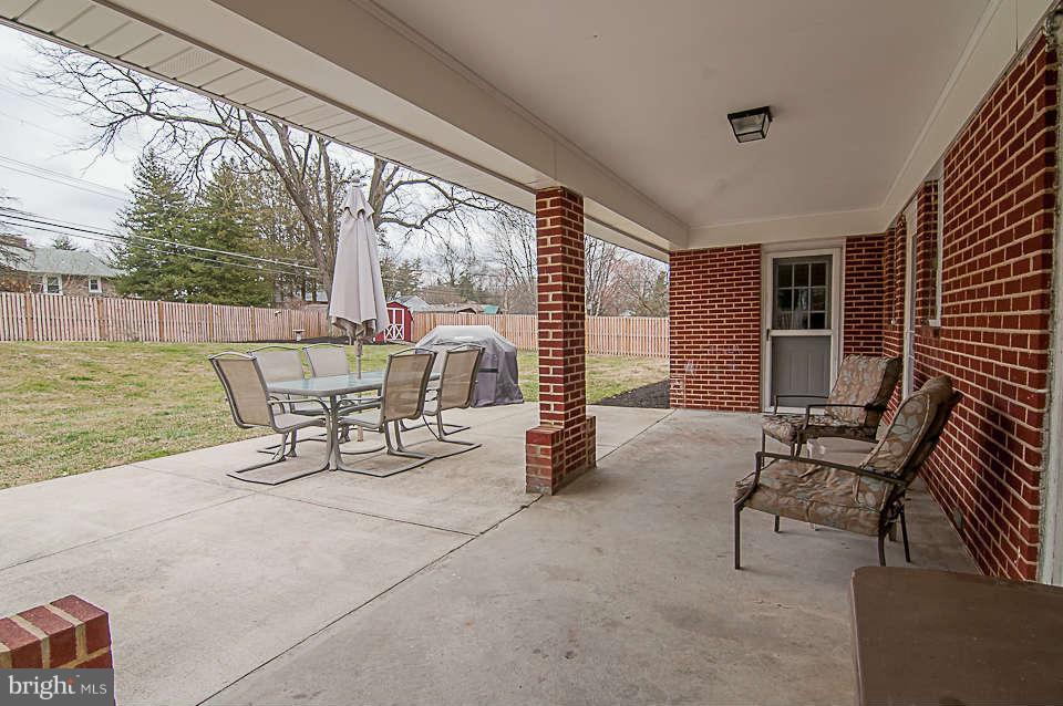 3721 Macalpine Road Ellicott City, MD 21042 - Photo 19 of 22 a building outdoor space with patio furniture and potted plants
