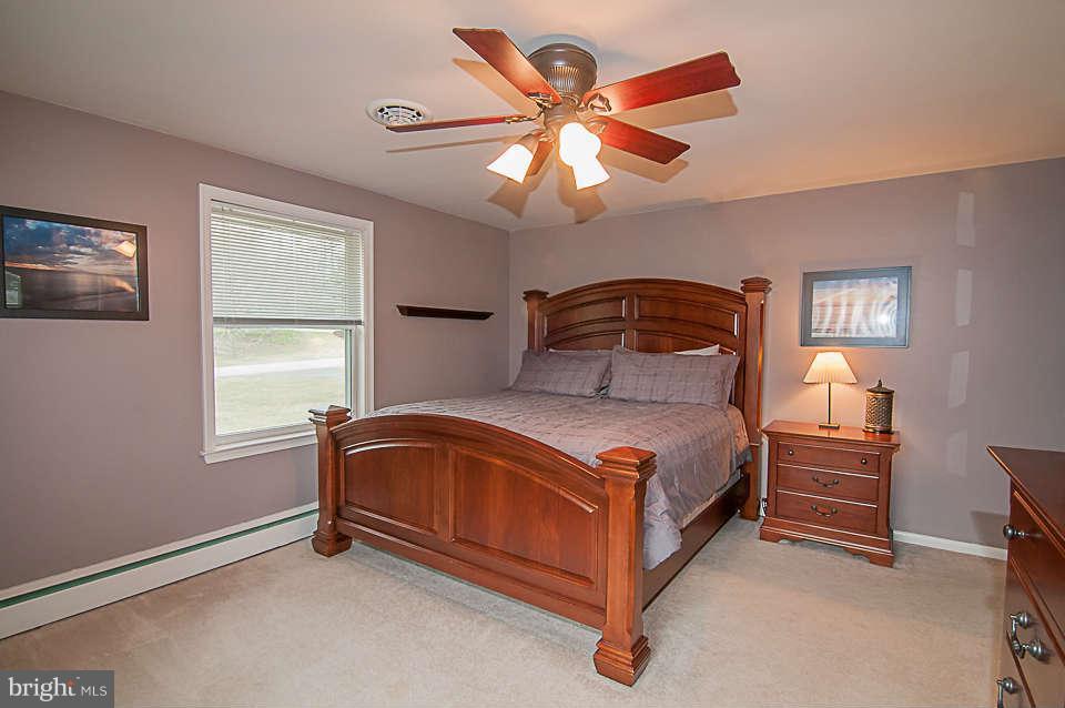 3721 Macalpine Road Ellicott City, MD 21042 - Photo 8 of 22 a bedroom with a bed and a window