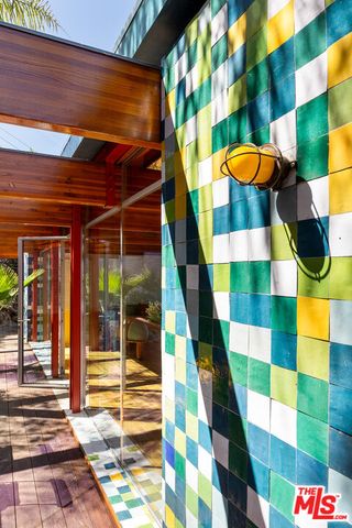 a backyard of a house with barbeque oven table and chairs