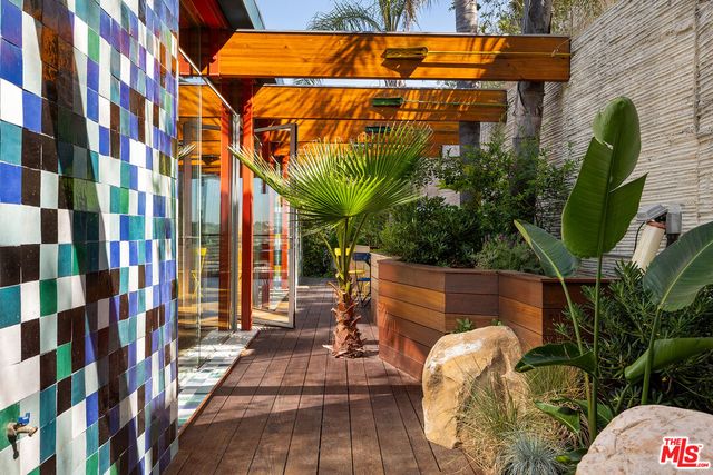 a bedroom with a bed and a mirror