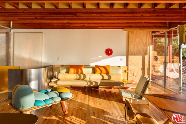 a bedroom with a bed and a lamp with wall painting