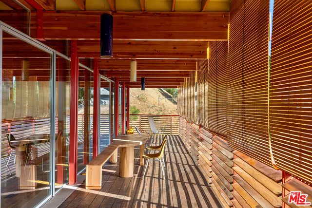 a bedroom with a large bed and a large window