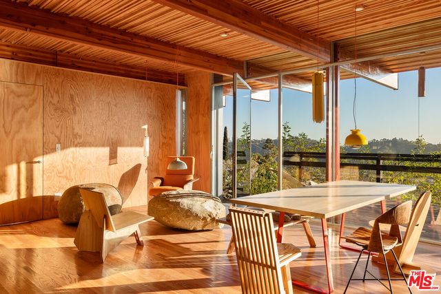 a outdoor dining space with furniture and outdoor view