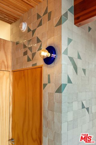 a bathroom with a mirror and a sink