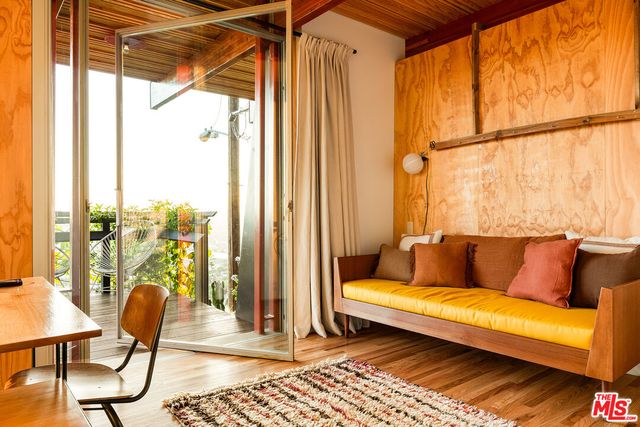 a view of a small yard in front of a house with a small yard