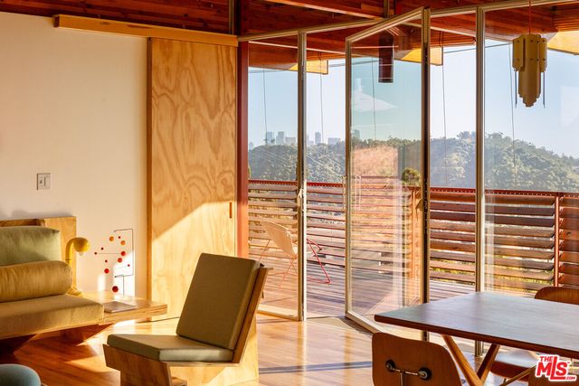 a view of a bedroom with furniture and windows