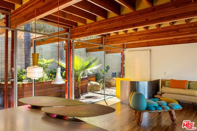 a view of swimming pool with outdoor seating