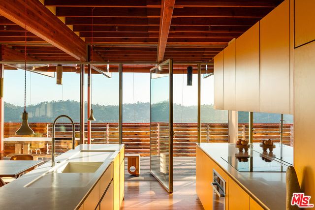 a view of a door and wooden floor