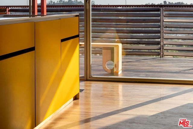 a view of balcony with a table and chairs