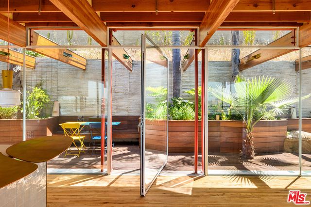 a view of a chairs and table in the patio