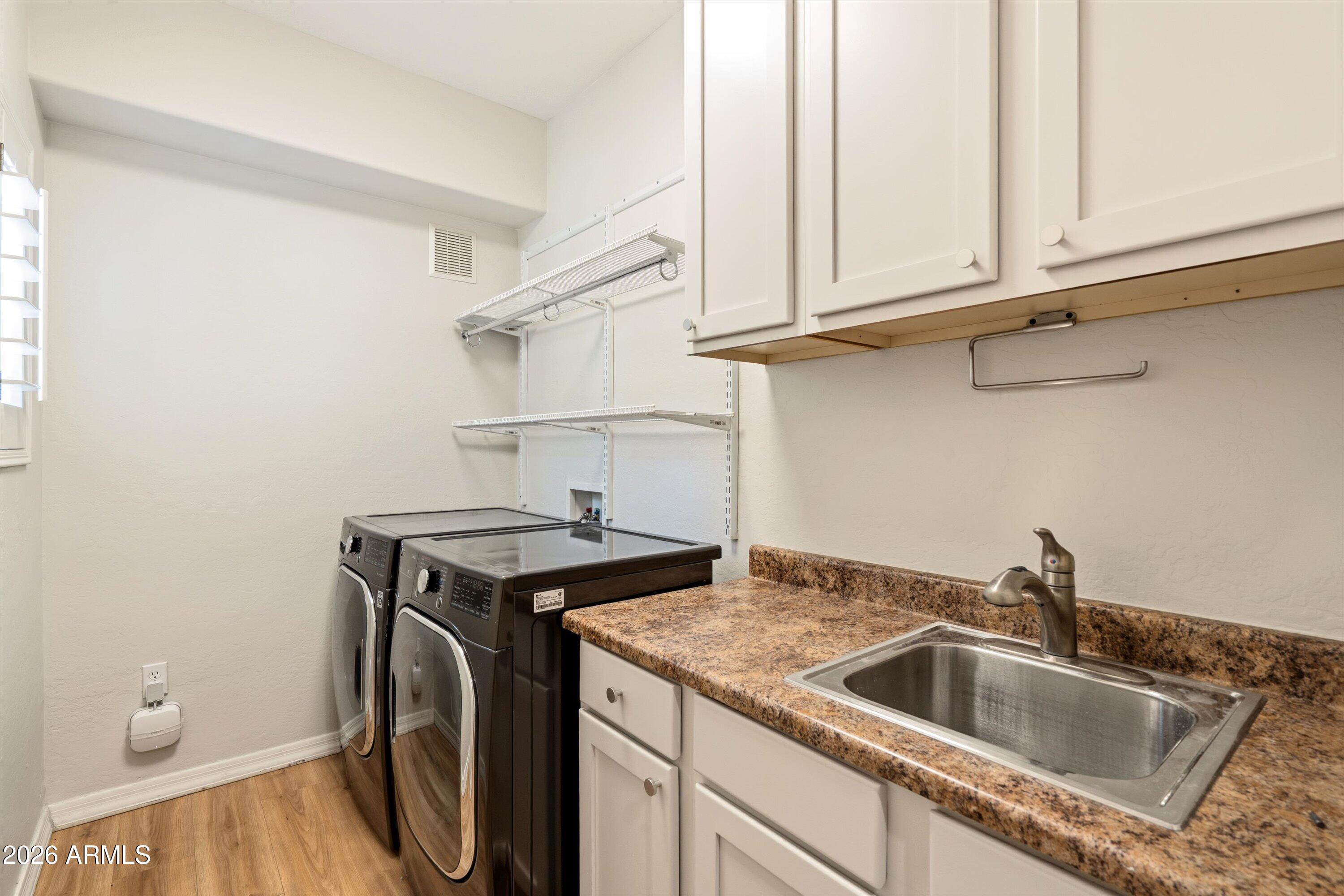 3935 East Rough Rider Road, Unit 1034 Phoenix, AZ 85050 - Photo 18 of 25 Laundry