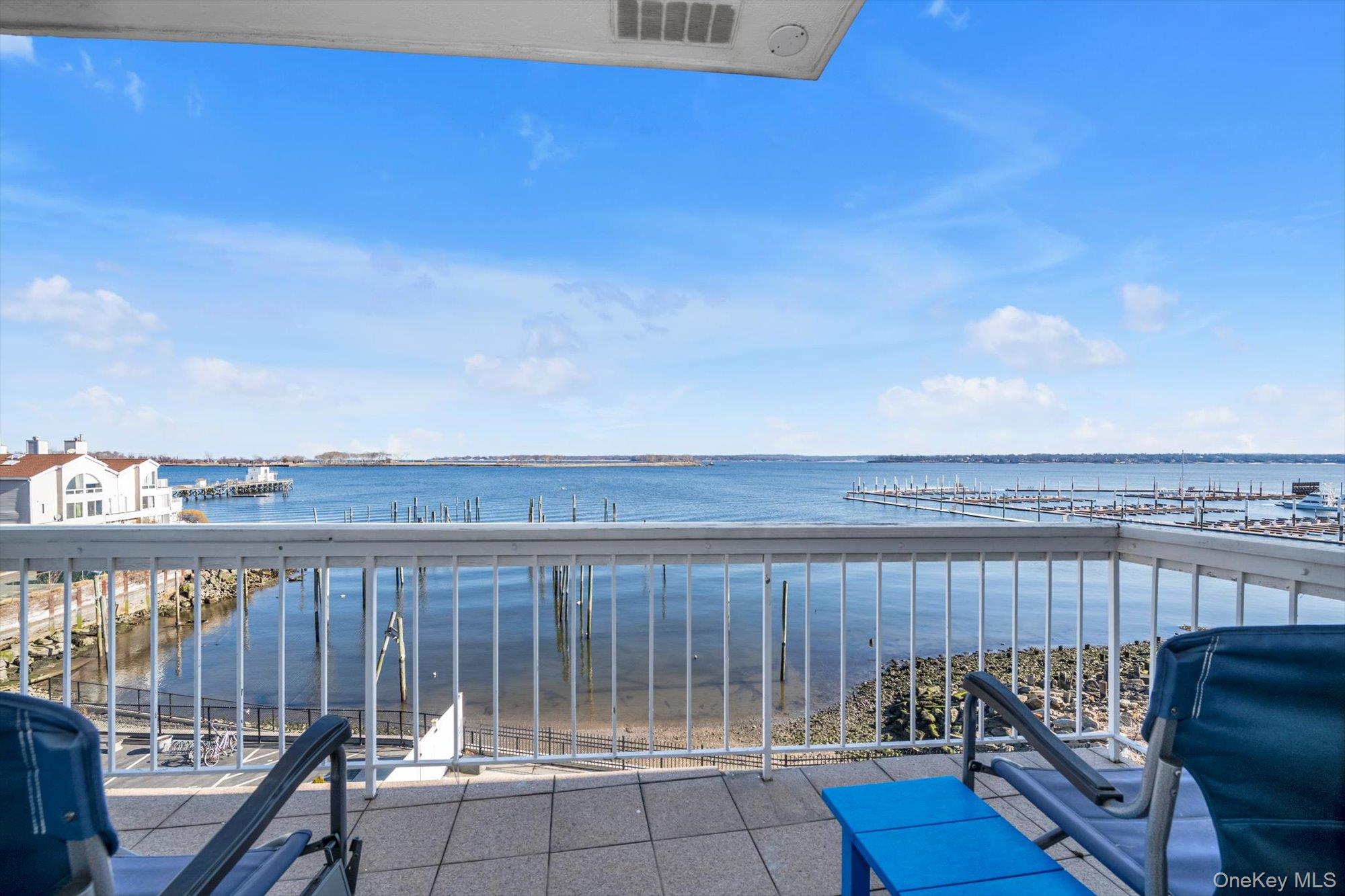 a view of a balcony with furniture