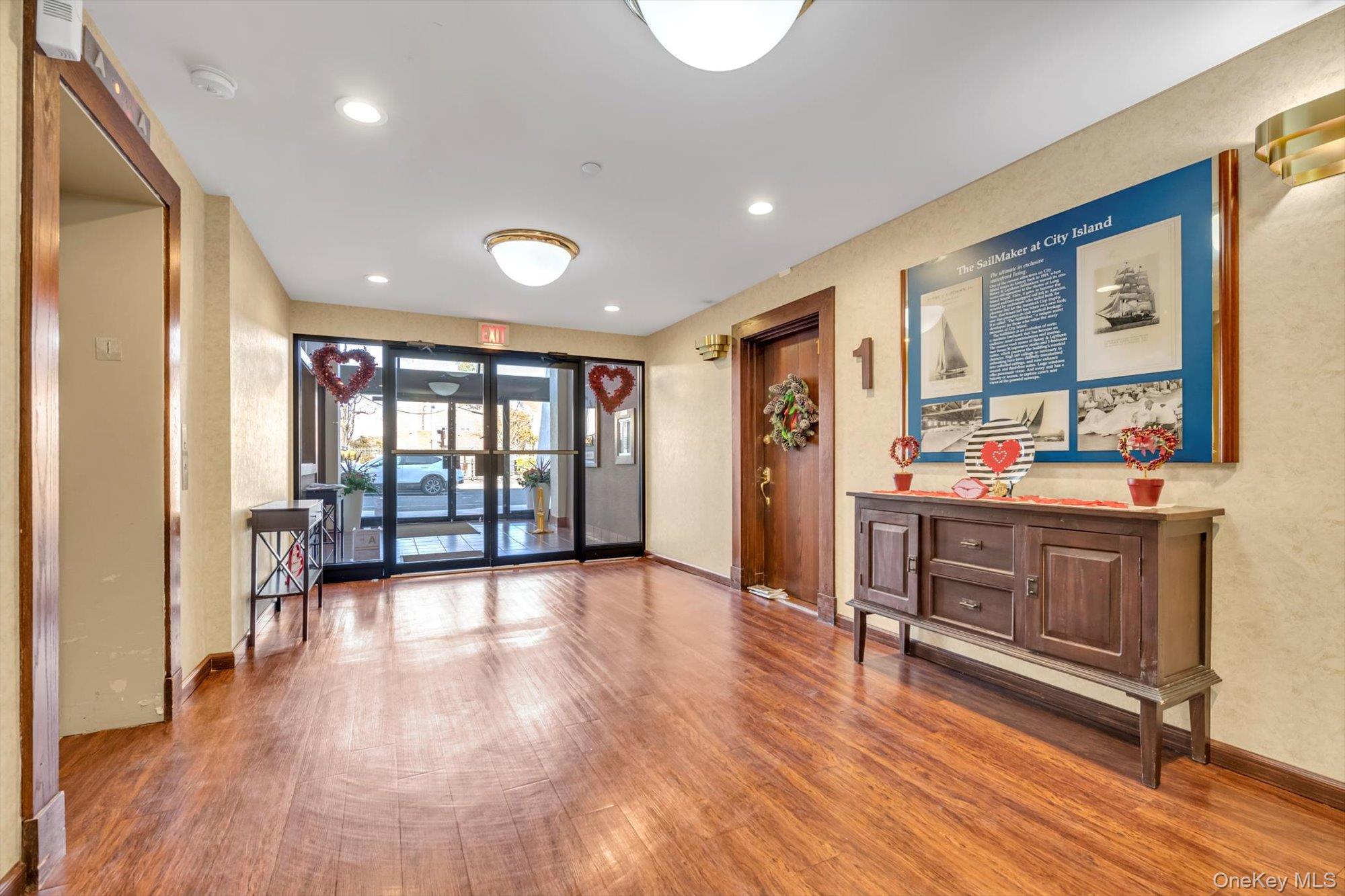 190 Schofield Street Bronx, NY 10464 - Photo 13 of 17 a living room with stainless steel appliances kitchen island granite countertop a stove a sink and a refrigerator with wooden floor