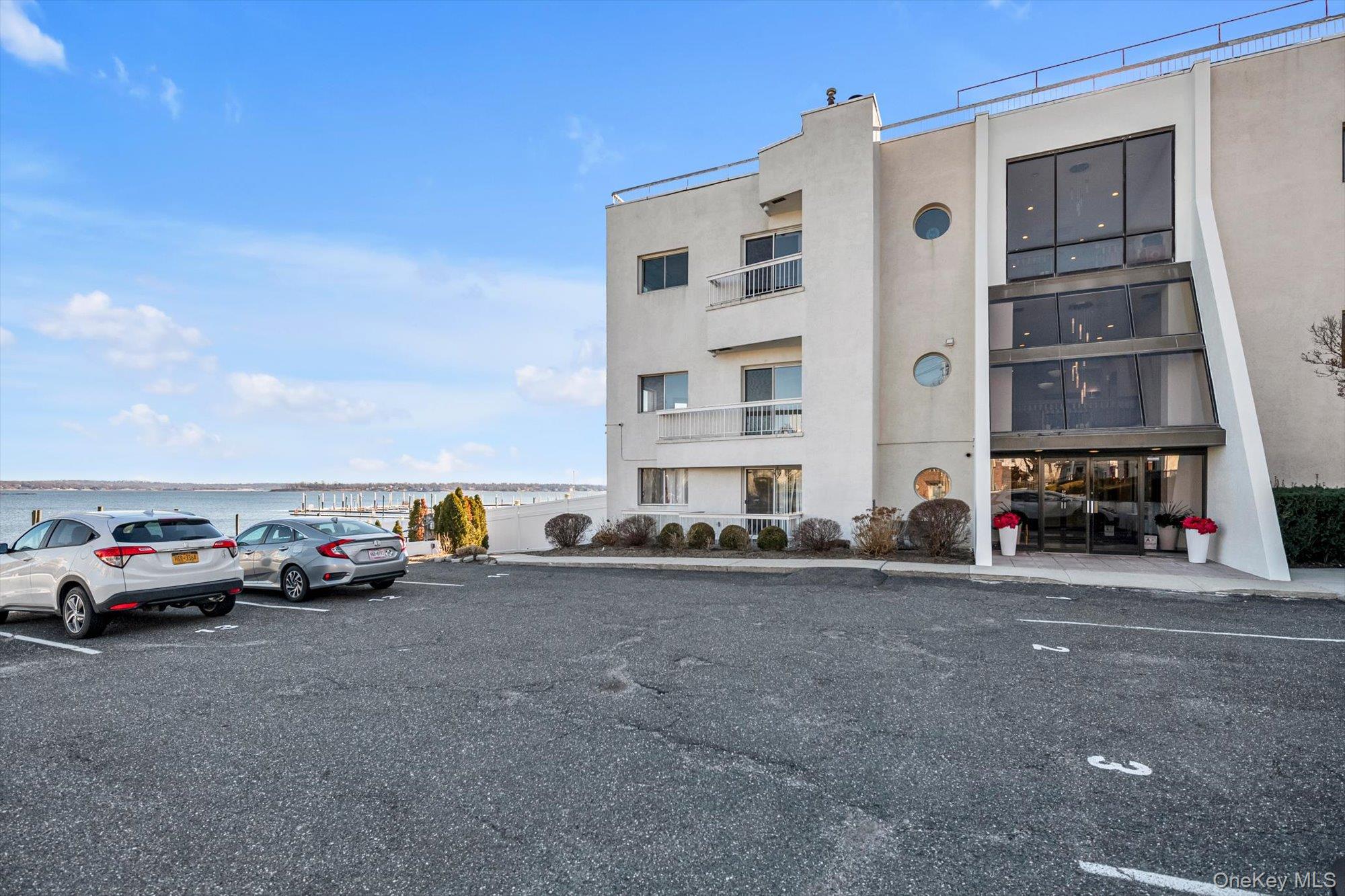 190 Schofield Street Bronx, NY 10464 - Photo 16 of 17 a view of cars parked in front of a building