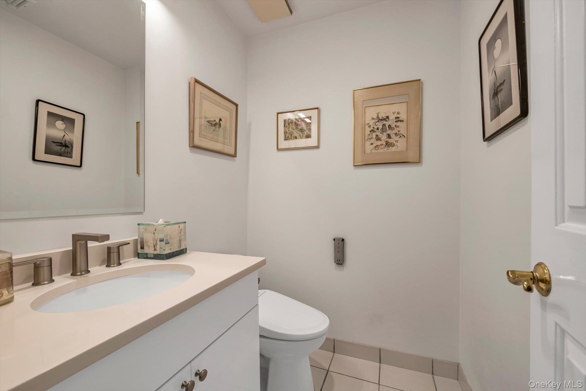 190 Schofield Street Bronx, NY 10464 - Photo 10 of 17 a bathroom with a sink toilet and a mirror