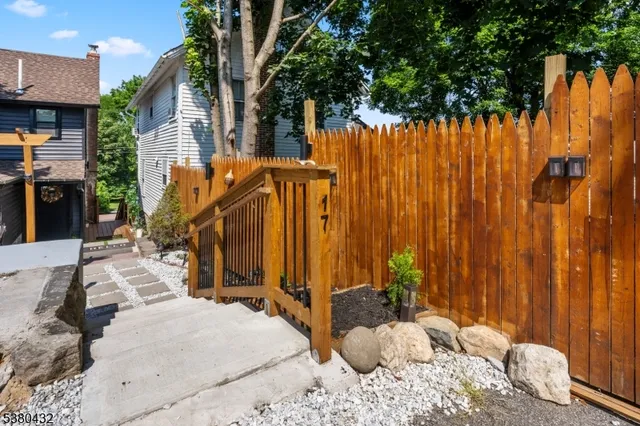 a view of a backyard with a large tree