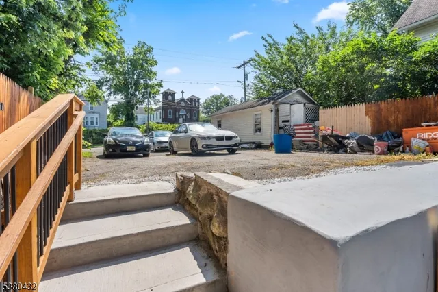 a view of backyard with sitting area