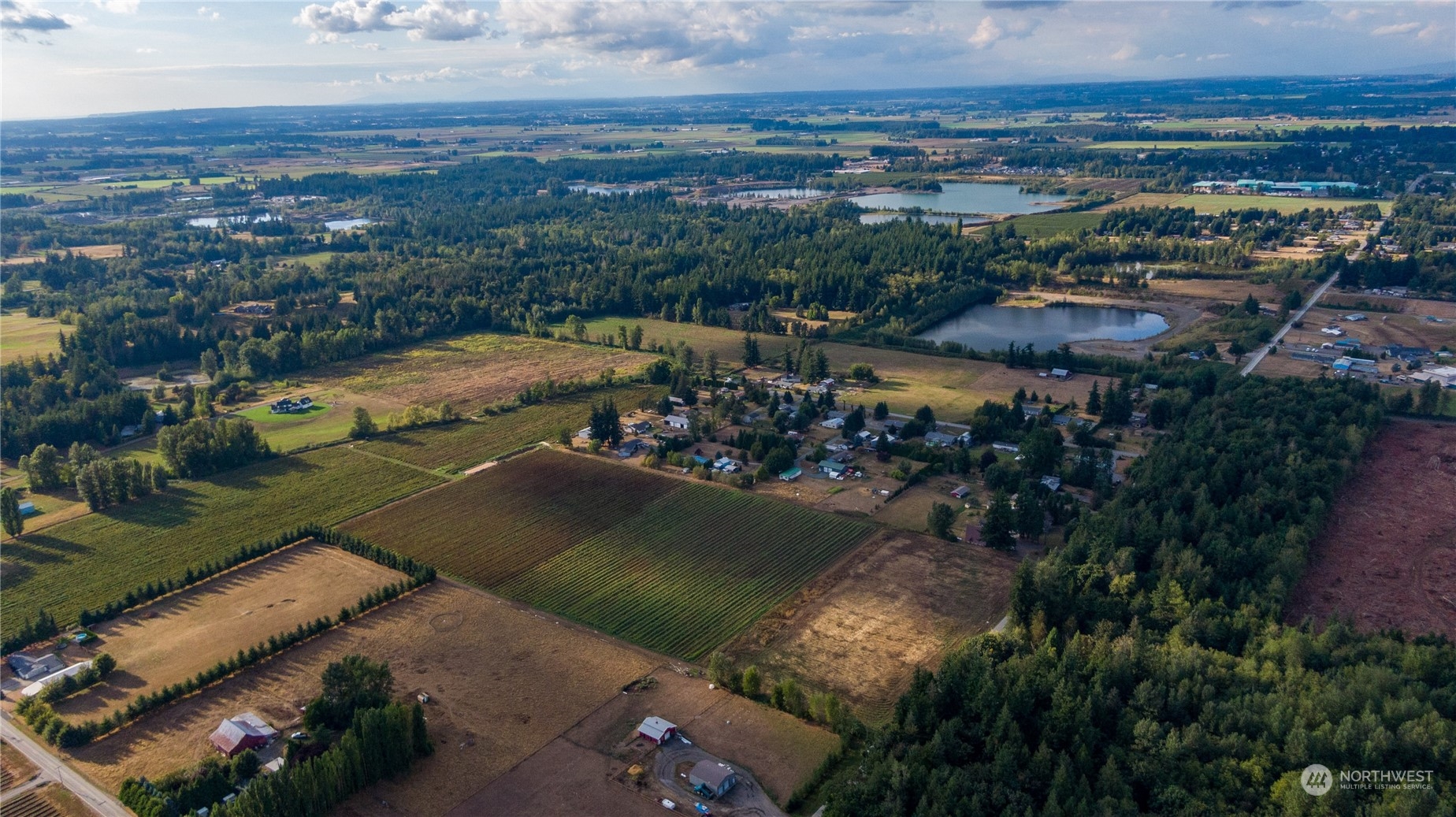 6573 Mission Road Everson, WA 98247 - Photo 22 of 40 an aerial view of a house with a lake view
