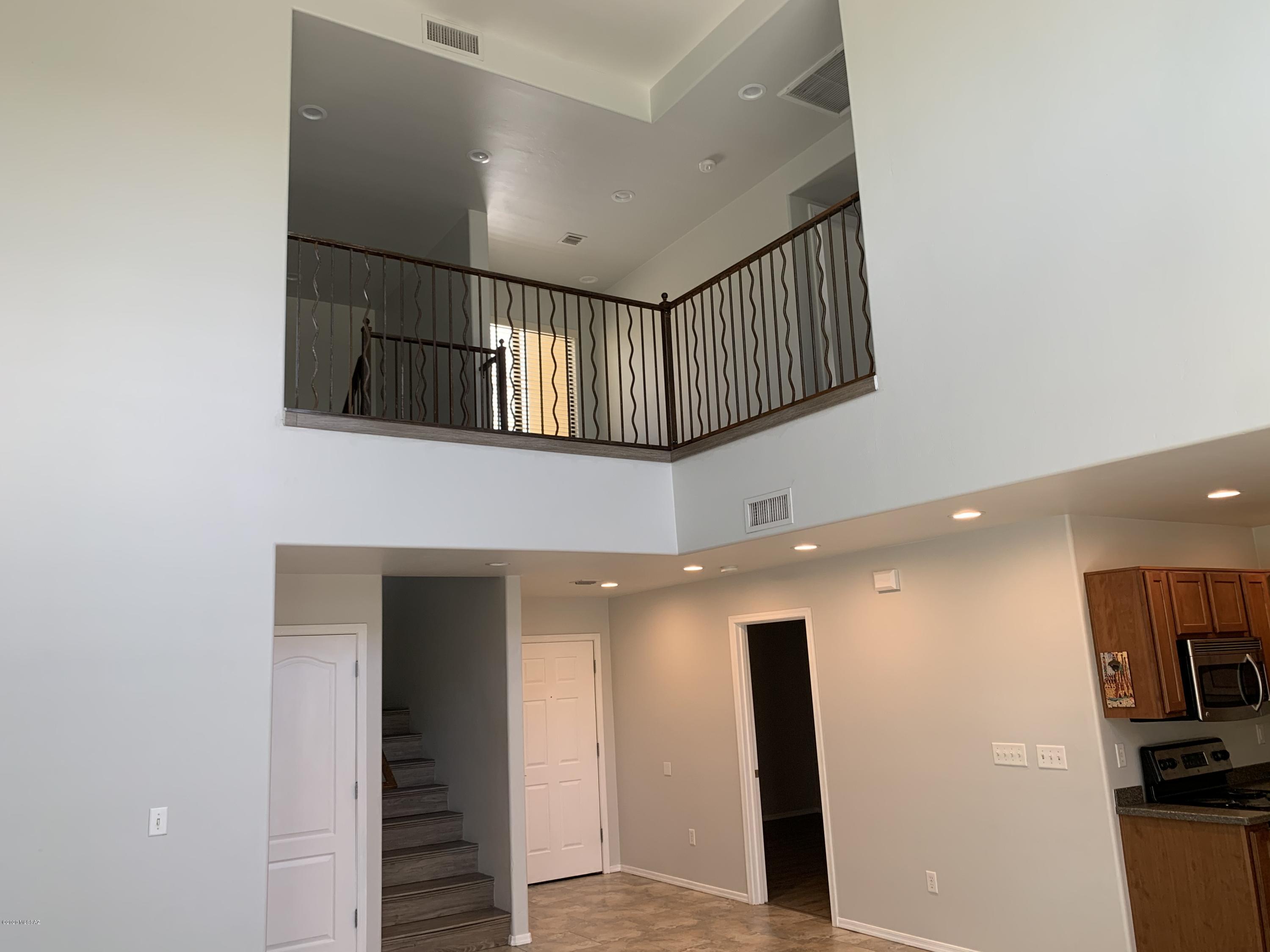 4181 North Fortune Loop Tucson, AZ 85719 - Photo 10 of 39 a view of entryway with furniture and wooden floor