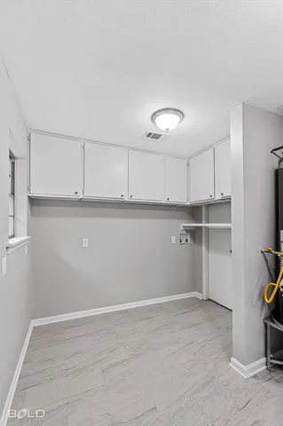 a large kitchen with cabinets