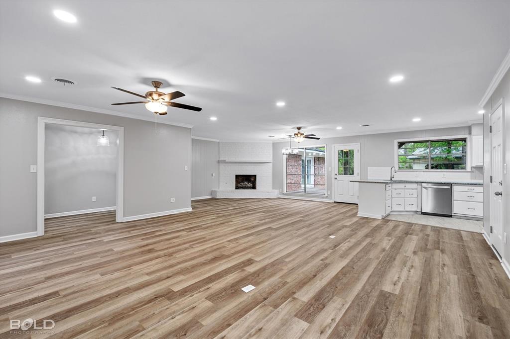 9471 Hemlock Circle Shreveport, LA 71118 - Photo 2 of 36 a view of a livingroom with a furniture wooden floor and chandelier