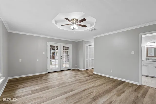 a view of cabinets and wooden floor