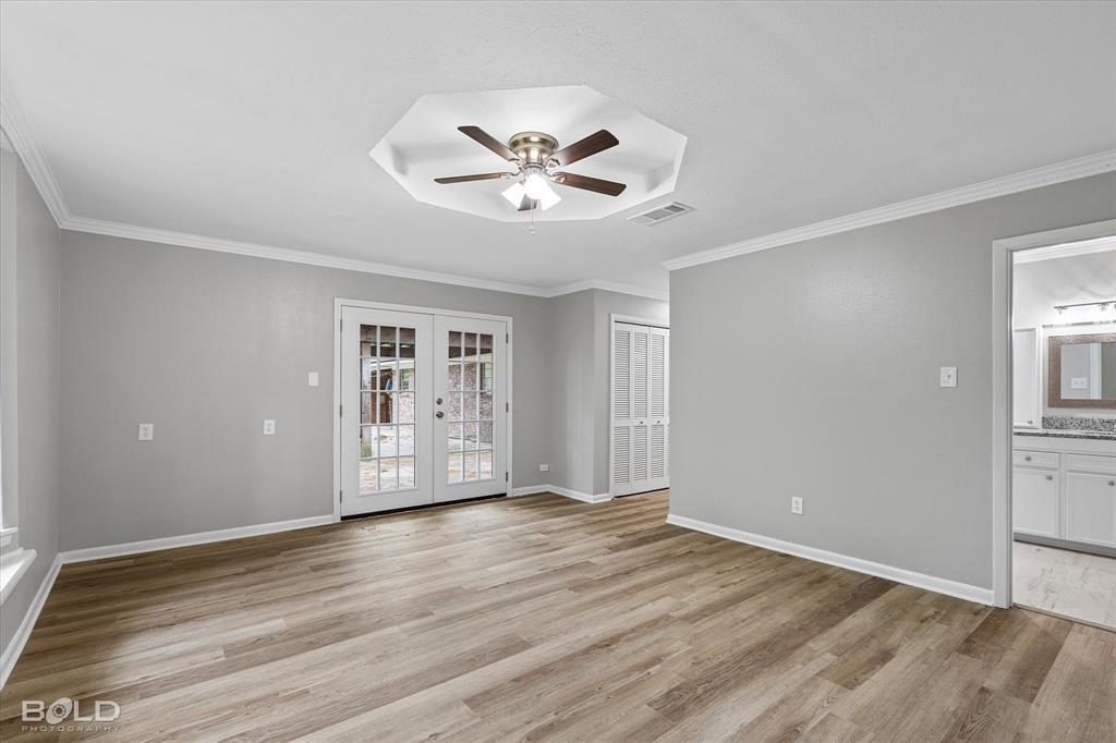 9471 Hemlock Circle Shreveport, LA 71118 - Photo 20 of 36 a view of an empty room with window and wooden floor