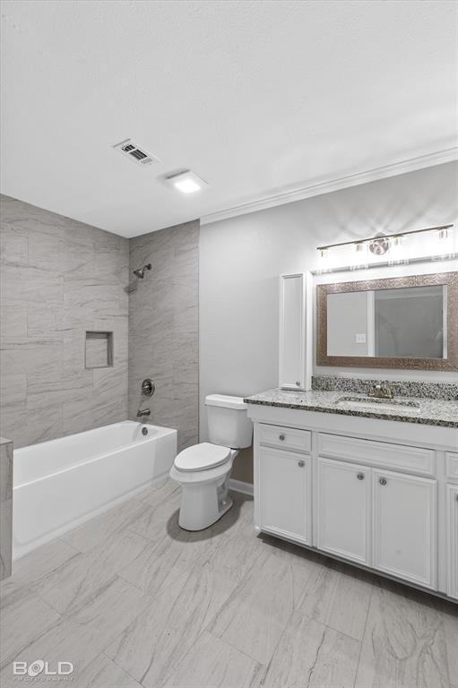 9471 Hemlock Circle Shreveport, LA 71118 - Photo 22 of 36 a bathroom with a granite countertop sink a toilet and bathtub