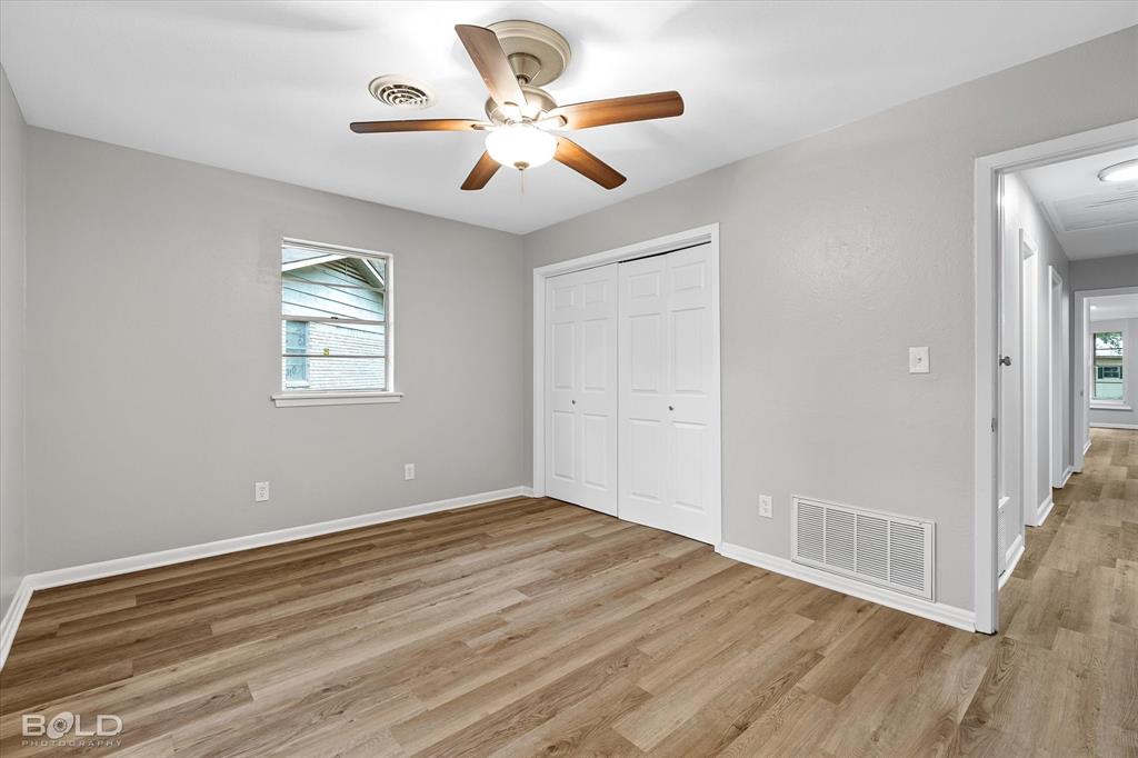 9471 Hemlock Circle Shreveport, LA 71118 - Photo 27 of 36 wooden floor in an empty room with a window