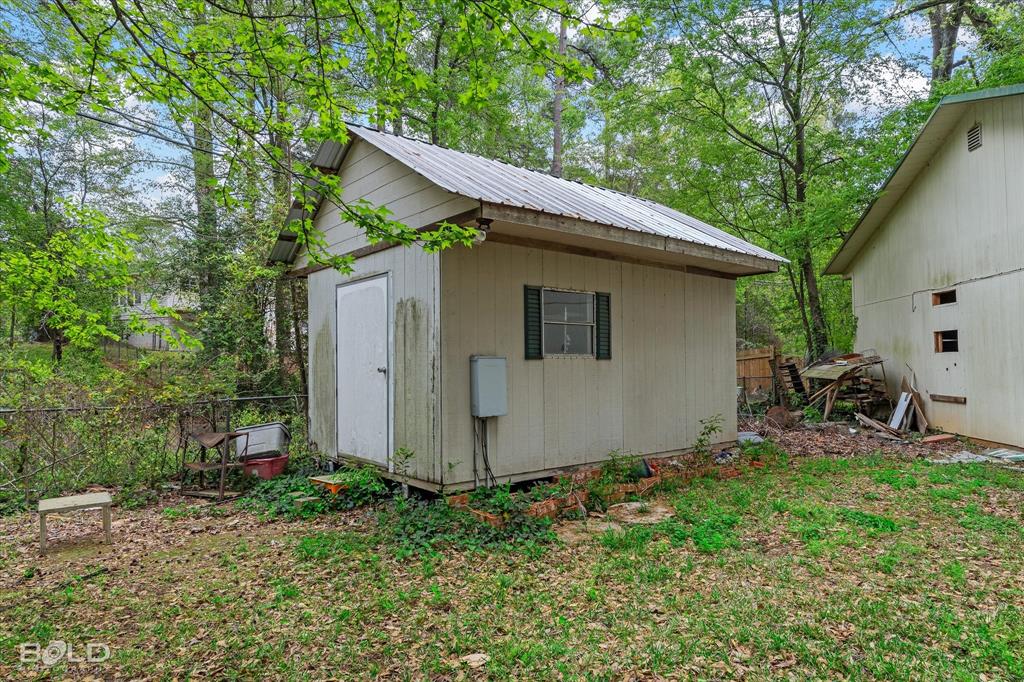 9471 Hemlock Circle Shreveport, LA 71118 - Photo 32 of 36 a view of backyard with plants and trees