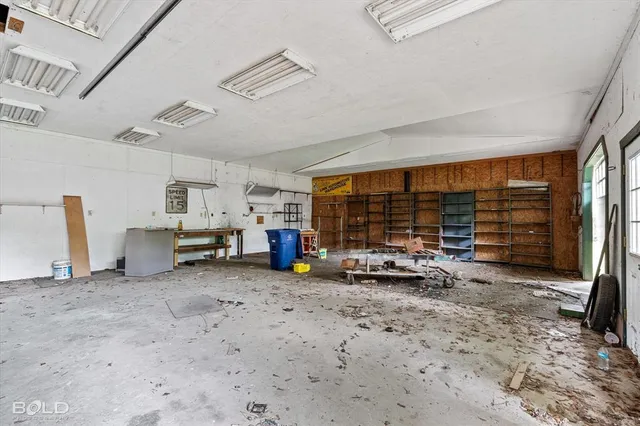 a view of a car garage with furniture