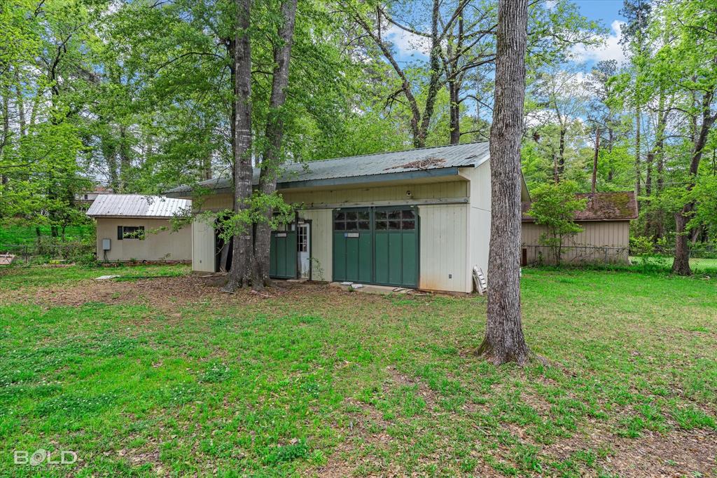 9471 Hemlock Circle Shreveport, LA 71118 - Photo 6 of 36 a view of a house with backyard and garden