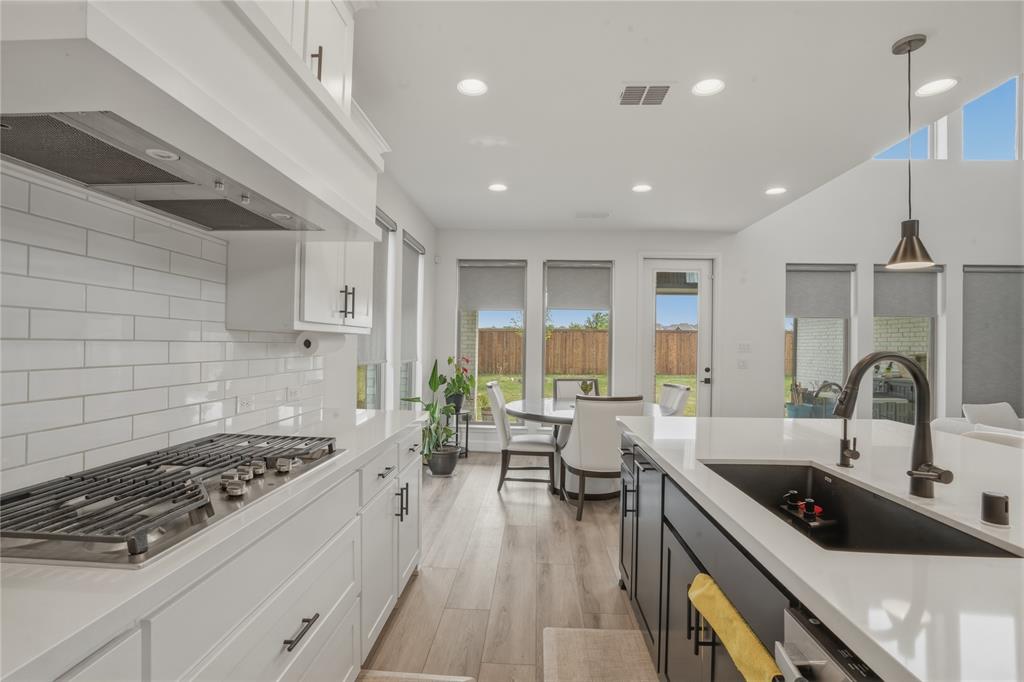 908 Maple Leaf Lane Haslet, TX 76052 - Photo 12 of 40 a kitchen with a sink appliances and a counter top space