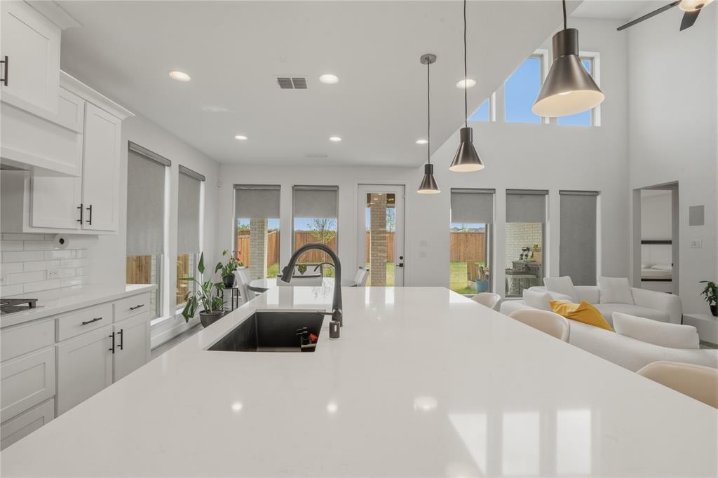 908 Maple Leaf Lane Haslet, TX 76052 - Photo 14 of 40 a kitchen with stainless steel appliances granite countertop a sink a stove and a refrigerator