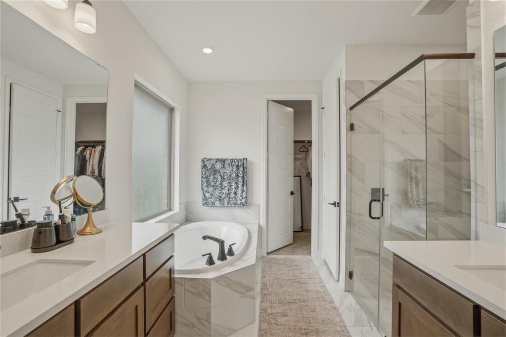 908 Maple Leaf Lane Haslet, TX 76052 - Photo 20 of 40 a bathroom with a sink a toilet and shower