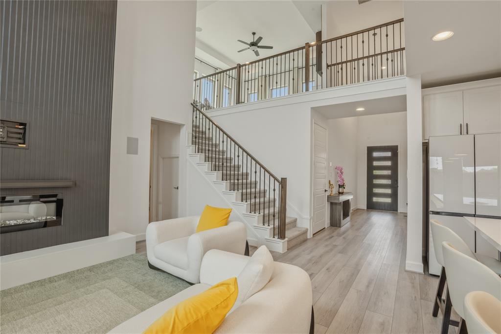 908 Maple Leaf Lane Haslet, TX 76052 - Photo 2 of 40 a view of a livingroom with furniture and stairs
