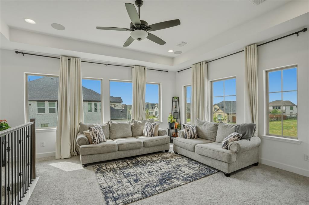 908 Maple Leaf Lane Haslet, TX 76052 - Photo 26 of 40 a living room with furniture and a large window