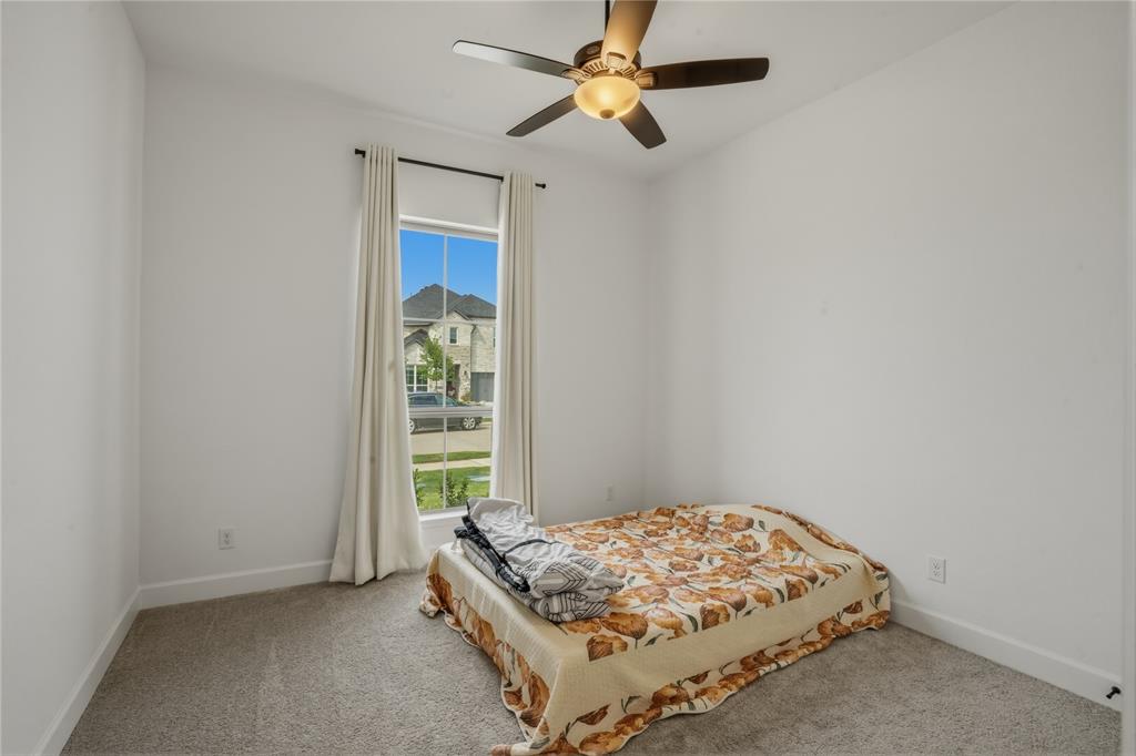 908 Maple Leaf Lane Haslet, TX 76052 - Photo 27 of 40 a bedroom with a bed and a window